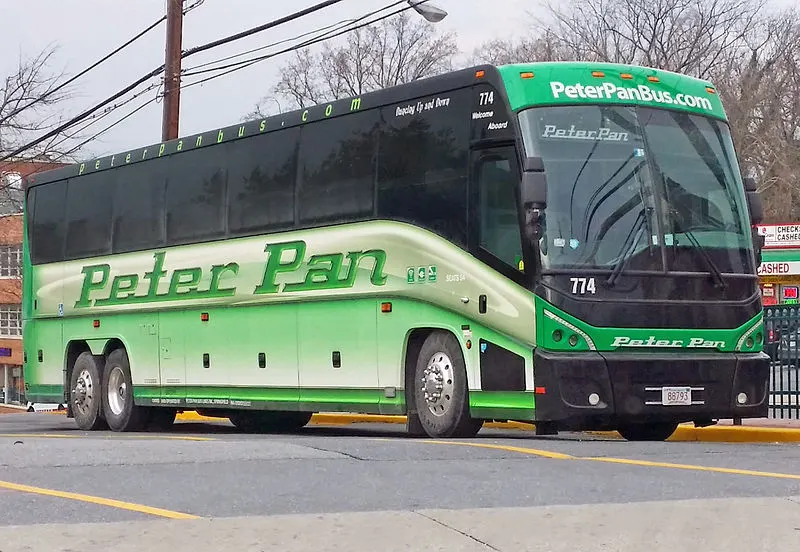 Green Peter Pan bus on the road 