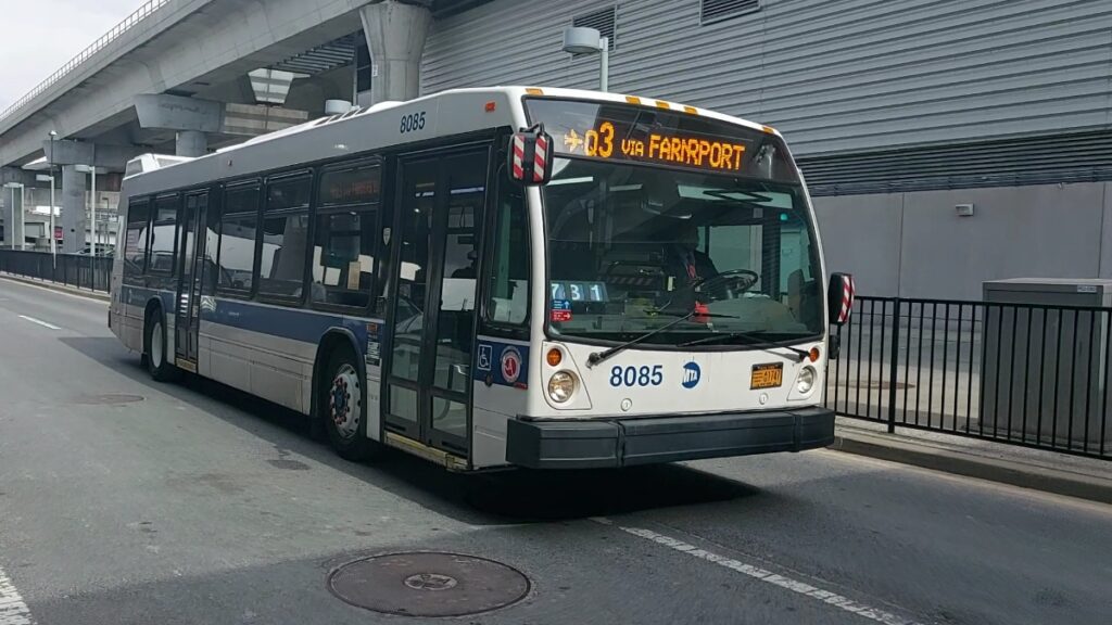 MTA city bus 8085 on Q3 route to Farrport in urban transit setting.